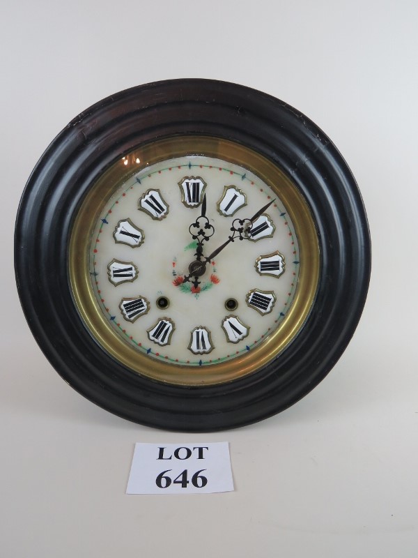 A 19th century French wall clock with enamel dial,