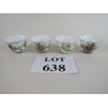 A set of four matching Chinese tea bowls with floral decoration and inscription,