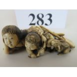 A exquisite quality Japanese Meiji period carved ivory okimono, signed,
