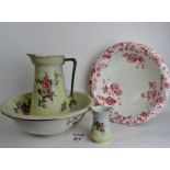 Late Victorian wash basin, jug and small vase in matching floral patterns,