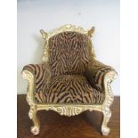 A late 20th Century carved armchair upho