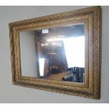 An early 20th century decorative gold wall mirror est: £15-£30