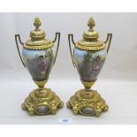 A pair of porcelain urns, with ormolu mo