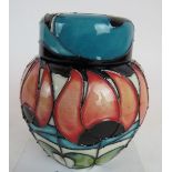 A contemporary Moorcroft ginger jar and