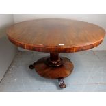 A 19th century walnut tilt top dining ta