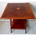 An Edwardian mahogany lamp table with sh