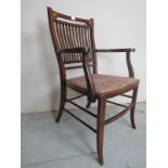An Edwardian inlaid mahogany armchair wi