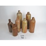 A collection of antique stoneware bottle