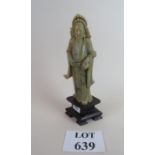 A carved Chinese figure of an elder in s