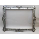 A large white metal frame, embossed with