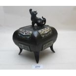 A Chinese metal pot and cover with clois