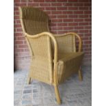 A contemporary rattan and bent-wood armc