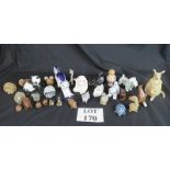 A collection of ceramic animals from var