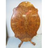 A Fine Victorian carved walnut tilt top