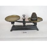 A set of cast iron kitchen balance scale