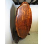 A superb 19th Century Rosewood tilt top supper table with a detailed shaped edge over a finely