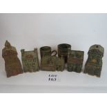 Five stoneware money boxes in the form o