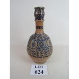 An Islamic vase with stylised blue decor