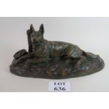 A cast bronze statue of an Alsatian dog tethered, with bowl of food, signature R.