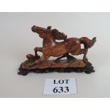 A Chinese carving of a horse in stone, o