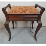 An Edwardian piano stool with a lift up