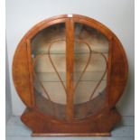 An Art Deco walnut circular glazed displ