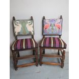A pair of period style oak framed chairs