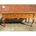 A 20th Century pine sideboard with four