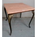 A small converted side table with pink m