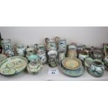 A large collection of Glyn Colledge Denby studio pottery to include 15 jugs, 2 shallow bowls,