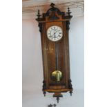 An imposing 19th century continental regulator wall clock with mahogany veneer and ebonised