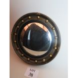 Ornate gold vintage convex mirror with a repeating spherical decorative frame,