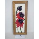 A contemporary Moorcroft 'Ruby Red' plaque, framed,