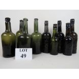 Four antique coloured wine bottles and five old advertising glass bottles est: £50-£100