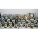 A vast collection of Glyn Colledge Denby tankards, from 11 cm to 15 cm tall,