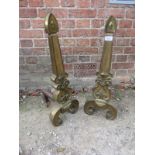 A pair of decorative brass fire dogs est: £30-£50