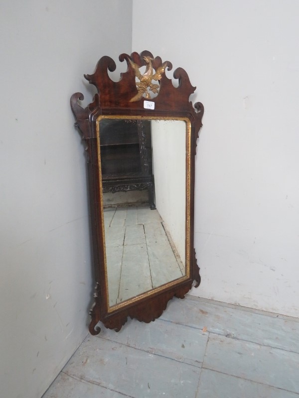 An 18th Century walnut wall mirror with gilt eagle to top est: £80-£120