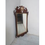 An 18th Century walnut wall mirror with gilt eagle to top est: £80-£120