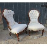 Two Victorian walnut and mahogany framed nursing chairs, one upholstered in cream material,