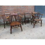 A fantastic set of six oak and elm smokers bow / captains chairs with turned spindle backs and legs