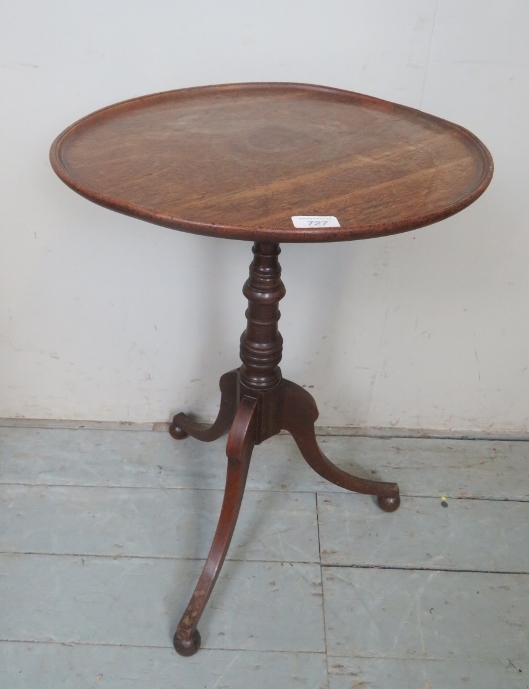 A pretty 19th Century mahogany tripod table with a dished top over a turned column and splayed legs