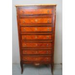 A French Louis XV - Revival inlaid and cross banded narrow chest of seven drawers with a marble top