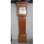 A fine oak cased 30 hour longcase clock with a hand painted dial inscribed 'Wraight & Woolley,