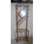 A fine colonial bamboo hall stand with inset mirror (slightly a/f) est: £50-£80