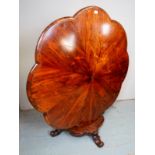 A fine Victorian rosewood tilt top breakfast table with a shaped edge top over bulbous column,