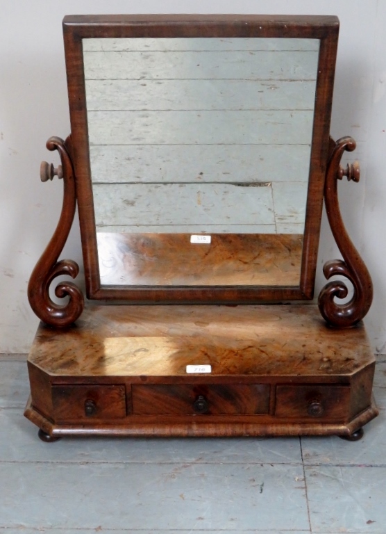 A 19th Century flame mahogany table top mirror with drawers to front est: £30-£50