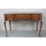 An early 20th Century walnut desk with five drawers over cabriole legs est: £70-£100