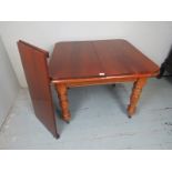 A late Victorian mahogany extending dining table with one additional leaf and in clean condition,