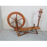 An early 20th Century wooden spinning wheel est: £30-£50