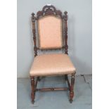 A 19th Century walnut carved chair with an upholstered back and seat est: £30-£50